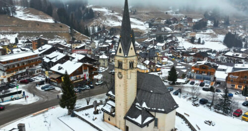 Arabba, Italy – January 8, 2025: Aerial drone view of the Arabba mountain village in the Dolomites, Italy - Starpik Stock