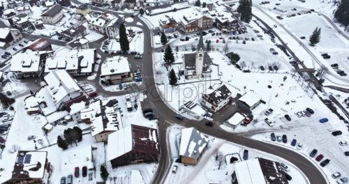 Arabba, Italy – January 8, 2025: Aerial drone view of the Arabba mountain village in the Dolomites, Italy - Starpik Stock