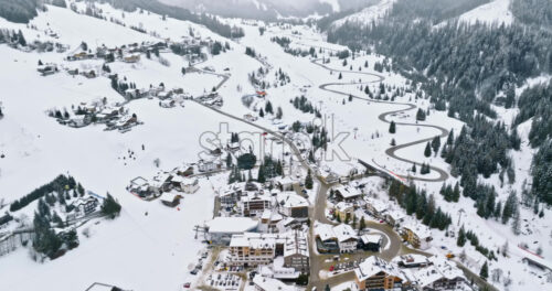 Corvara in Badia, Italy – January 12, 2025: Aerial drone view of the Corvara village covered in snow, in South Tyrol, Dolomites, in northern Italy - Starpik Stock