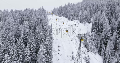 Corvara in Badia, Italy – January 9, 2025: Aerial drone view of a ski lift in Corvara, in South Tyrol, the Dolomites - Starpik Stock