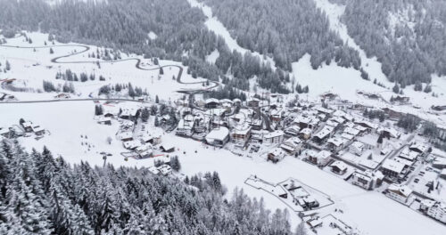 Corvara in Badia, Italy – January 9, 2025: Aerial drone view of the Corvara village covered in snow, in South Tyrol, Dolomites, in northern Italy - Starpik Stock