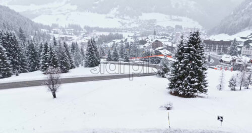 Corvara in Badia, Italy – January 9, 2025: Aerial drone view of the Corvara village covered in snow, in South Tyrol, Dolomites, in northern Italy - Starpik Stock