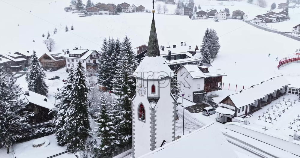 Corvara in Badia, Italy – January 9, 2025: Aerial drone view of the Corvara village covered in snow, in South Tyrol, Dolomites, in northern Italy - Starpik Stock