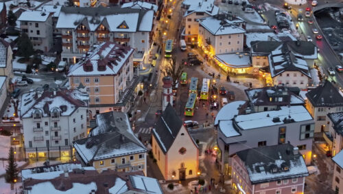 Ortisei, Italy – January 10, 2025: Aerial drone view the Ortisei town covered in snow with Christmas decorations, within the Dolomites, Italy - Starpik Stock