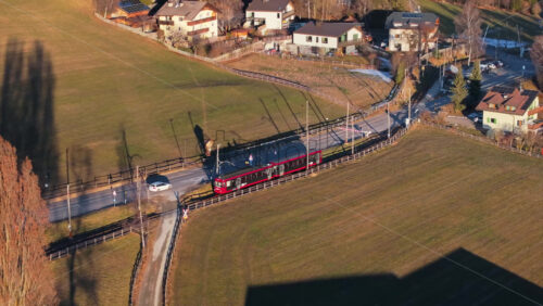 Soprabolzano, Italy – January 12, 2025: Aerial drone view of the The Ritten Railway on the Renon plateau in the Dolomites - Starpik Stock