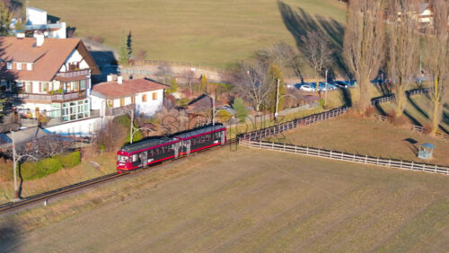 Soprabolzano, Italy – January 12, 2025: Aerial drone view of the The Ritten Railway on the Renon plateau in the Dolomites - Starpik Stock