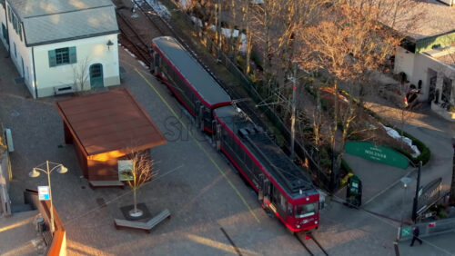 Soprabolzano, Italy – January 12, 2025: Aerial drone view of the The Ritten Railway on the Renon plateau in the Dolomites - Starpik Stock