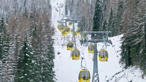 South Tyrol, Italy – Januaray 15, 2025: Aerial drone view of a ski lift in Corvara, in the Dolomites - Starpik Stock
