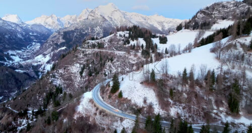 Video – Aerial drone view of snow on the mountains in the Dolomites, Italy - Starpik Stock