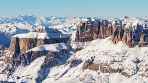 Video – Aerial drone view of the Marmolada mountain in the Dolomites, northeastern Italy with the blue sky on the background - Starpik Stock