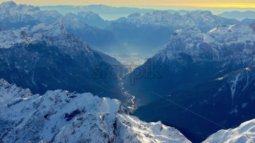 Video – Aerial drone view of the Marmolada mountain in the Dolomites, northeastern Italy with the blue sky on the background - Starpik Stock