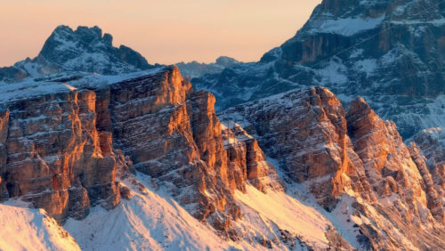 Video Aerial drone view of snow on the mountains in the Dolomites, Italy - Starpik Stock