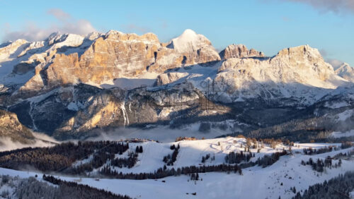 video Aerial drone view of snow on the mountains in the Dolomites, Italy - Starpik Stock