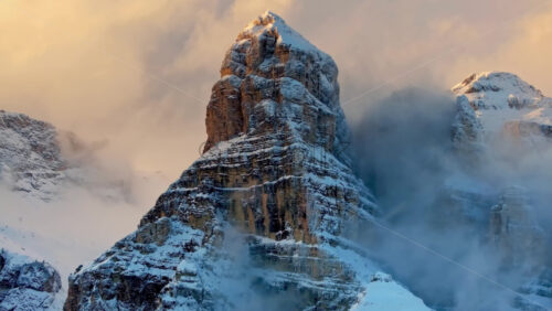 video Aerial drone view of snow on the mountains in the Dolomites, Italy - Starpik Stock