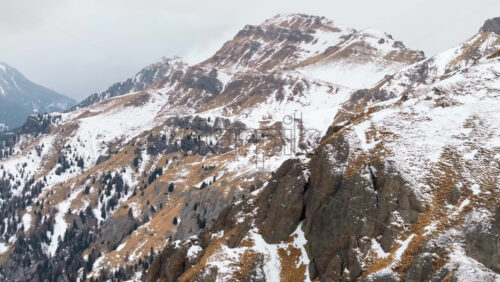 video Aerial drone view of snow on the mountains in the Dolomites, Italy - Starpik Stock