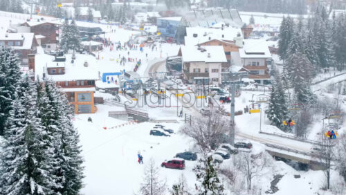 video Corvara in Badia, Italy – January 10, 2025: Aerial drone view of a ski resort in Corvara in Badia covered in snow, in South Tyrol, the Dolomites - Starpik Stock
