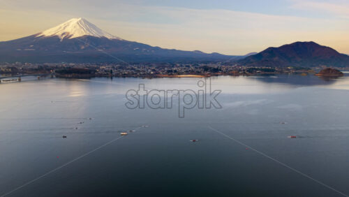 Aerial drone view of rowing boats moving - Starpik Stock