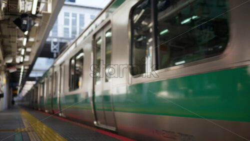 Close up of a subway arriving at the station in Tokyo, Japan - Starpik Stock