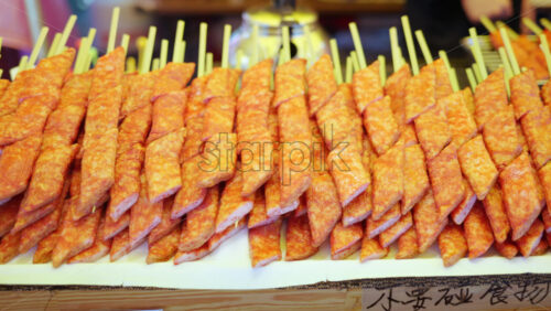 Close up of crab meat skewers at a street food market in Japan - Starpik Stock