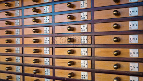 Close up of fortune drawers at the Senso-ji temple in Asakusa, Tokyo, Japan - Starpik Stock