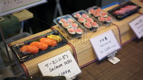 Close up of packed sushi rolls at the Tsukiji Fish Market in Tokyo, Japan - Starpik Stock