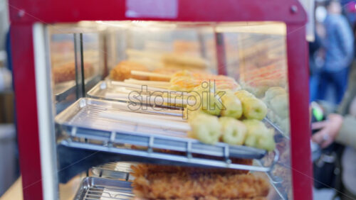 Different types of deep fried seafood on display at the Tsukiji Fish Market in Japan - Starpik Stock