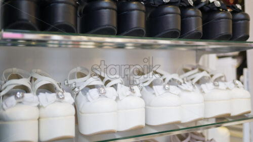 Multiple platform shoes on display in a store on the Takeshita shopping street in Tokyo, Japan - Starpik Stock