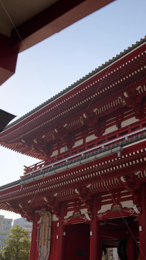 View of the Senso-ji temple with the blue sky on the background in Asakusa, Japan. Vertical - Starpik Stock