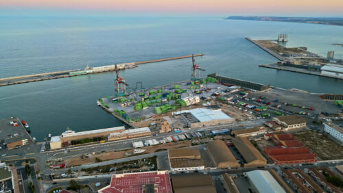 Aerial drone view of a Cargo terminal in Alicante, Spain at sunset - Starpik Stock