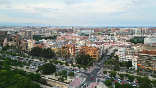 Aerial drone view of cars moving on the streets of Valencia, Spain in daylight - Starpik Stock