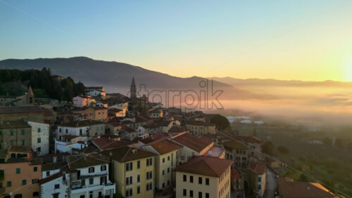 Aerial drone view of the Barga medieval town and comune of the province of Lucca in Tuscany, Italy - Starpik Stock
