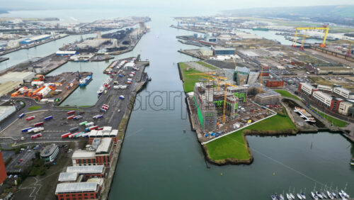 Aerial drone view of the Belfast Harbour in Northern Ireland in daylight - Starpik Stock