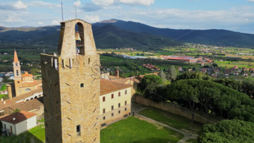 Aerial drone view of the Cassero Tower in Castiglion Fiorentino, Tuscany, Italy - Starpik Stock