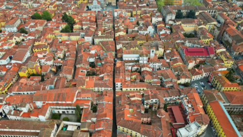 Aerial drone view of the Lucca city on the Serchio river in Italy’s Tuscany region - Starpik Stock