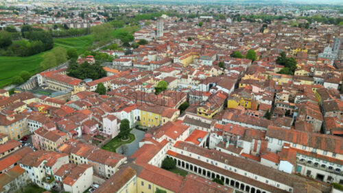 Aerial drone view of the Lucca city on the Serchio river in Italy’s Tuscany region - Starpik Stock
