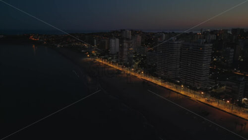 Aerial drone view of the Mediterranean Sea and the Alicante city in Spain at sunset - Starpik Stock