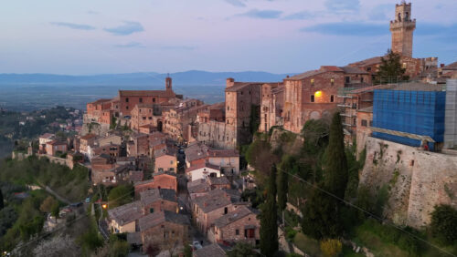 Aerial drone view of the Montepulciano medieval hilltop town in Tuscany, Italy, surrounded by vineyards - Starpik Stock