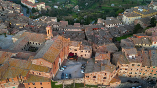 Aerial drone view of the Montepulciano medieval hilltop town in Tuscany, Italy, surrounded by vineyards - Starpik Stock
