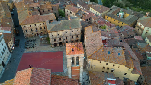 Aerial drone view of the Montepulciano medieval hilltop town in Tuscany, Italy, surrounded by vineyards - Starpik Stock