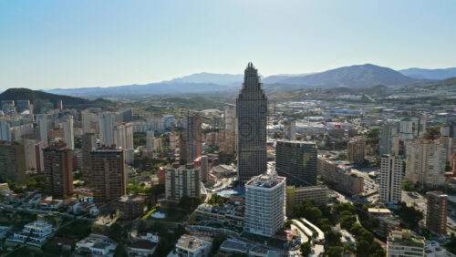 Aerial drone view of the buildings in Benidorm, Spain in daylight - Starpik Stock