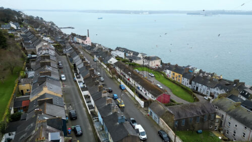 Aerial drone view of the colourful houses in Cobh, near the Cork Harbour in Ireland - Starpik Stock
