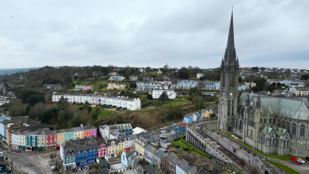 Aerial drone view of the colourful houses surrounding the St Colman’s Cathedral in Cork, Ireland - Starpik Stock
