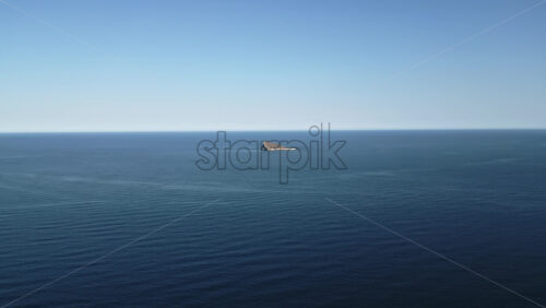 Aerial drone view of the small Benidorm Island and nature reserve on the Mediterranean Sea in Benidorm, Spain - Starpik Stock