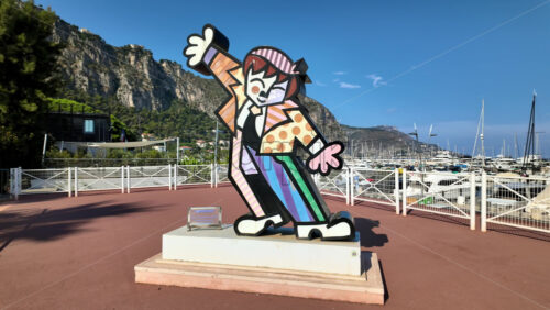 Video - Beaulieu-sur-Mer, France - July 5, 2024: Dancing Boy by Romero Britto figurine near a port