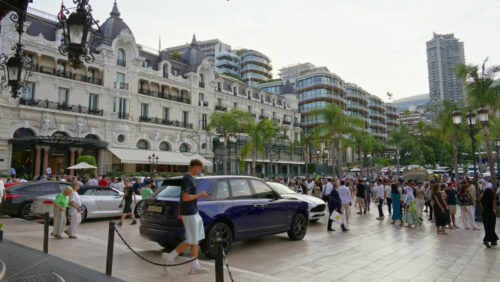 Video - Monte Carlo, Monaco - October 4, 2024: People walking through the courtyard of the Monte-Carlo Casino