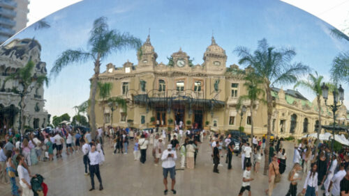 Video - Monte Carlo, Monaco - October 4, 2024: Sky mirror sculpture in front of The Monte Carlo Casino with people walking around it