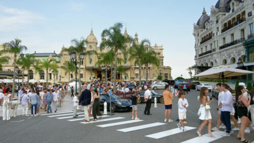 Video - Monte Carlo, Monaco - September 14, 2024: People crossing the street in front of the Monte Carlo Casino