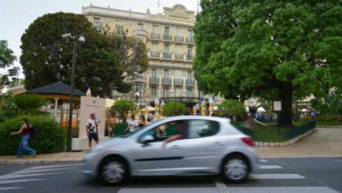 Video - Monte Carlo, Monaco - September 14, 2024: People crossing the street in front of the Monte Carlo Casino