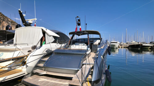 Video - Beaulieu-sur-Mer, France - July 5, 2024: White boats docked in the Port of Beaulieu-sur-Mer in daylight