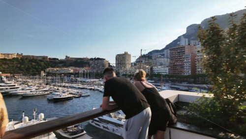 Video - La Condamine, Monaco - September 8, 2024: View of white boats docked in the Monaco Marina with the skyline of the city on the background